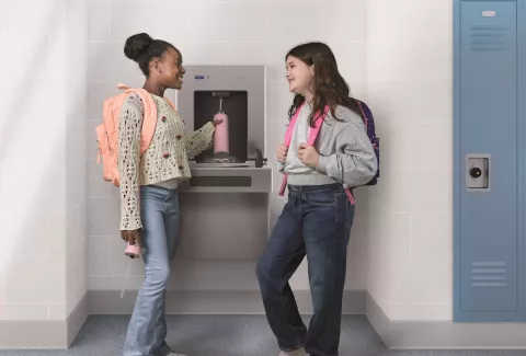 students at bottle filler station